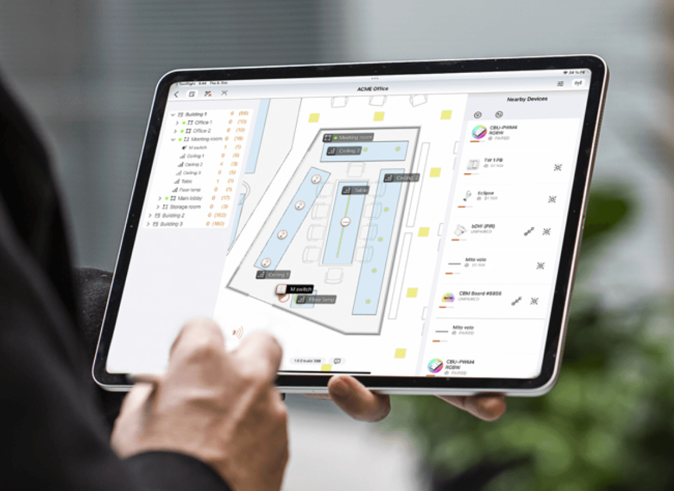Tablet displaying the Casambi app with an office floor plan and connected lighting devices.