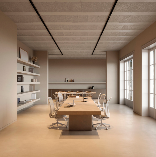 Modern meeting room filled with natural light, featuring a large wooden table and white chairs.