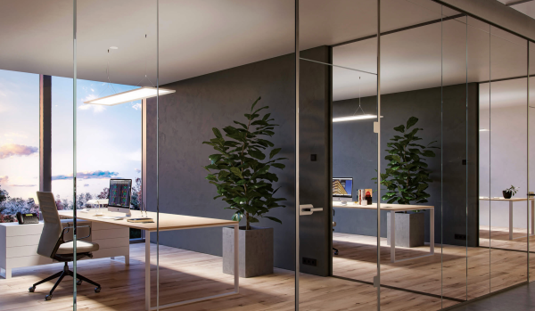 Modern glass offices with soft evening natural light, minimalist furniture, and green plants adding warmth.