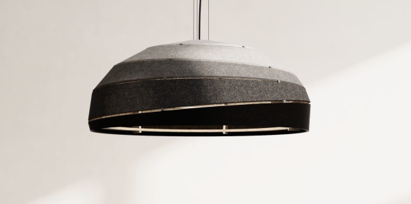 Dome-shaped acoustic pendant made of layered grey-to-black bands, featuring an open illuminated base, photographed against a light background.