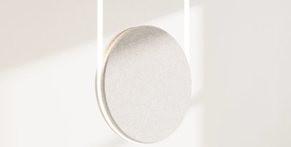 Light beige circular acoustic pendant made of two layered discs, photographed against a soft, light background.