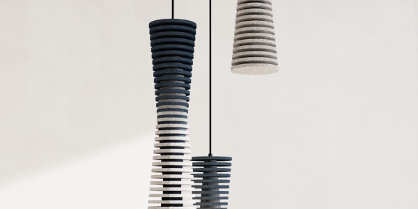 Cylindrical acoustic pendant lights made of stacked rings in blue and grey gradients, photographed against a light background.