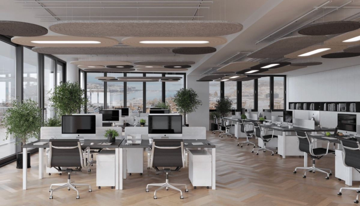 Bureaux modernes et lumineux équipés de luminaires acoustiques Akúslim suspendus au plafond, combinant confort visuel, design épuré et réduction du bruit ambiant.
